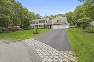 5 Lancaster Ln, Bourne, MA 02532 - colonial inspired home with asphalt driveway, an attached garage, and a front lawn