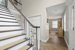 5 Lancaster Ln, Bourne, MA 02532 - stairs featuring baseboards