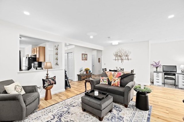 living room with light hardwood / wood-style floors