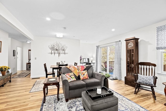 living room with light hardwood / wood-style floors