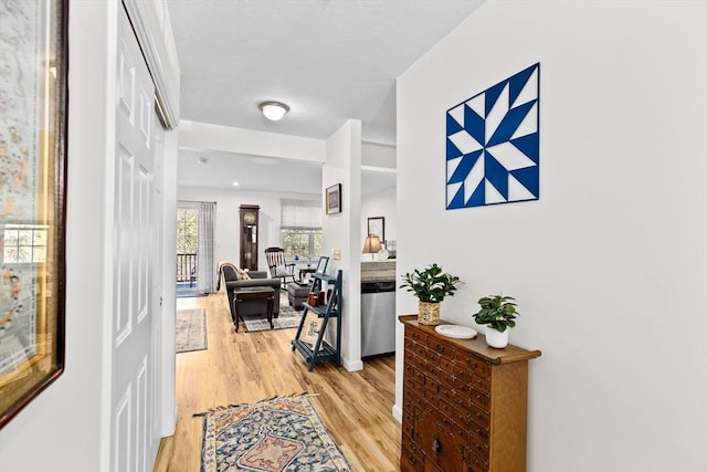 hall with light hardwood / wood-style floors