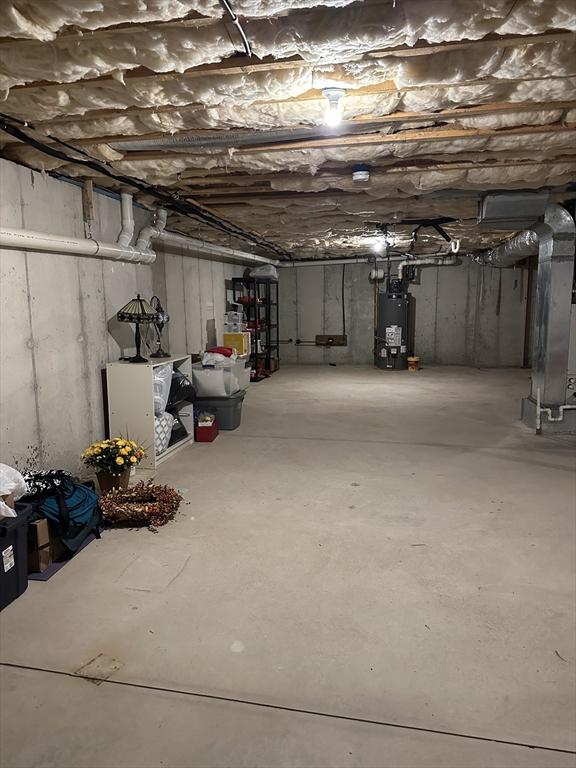 basement with gas water heater and heating unit