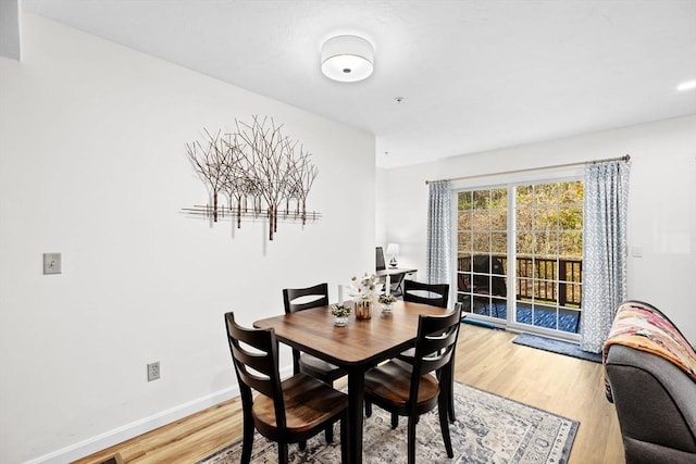 dining room with hardwood / wood-style flooring