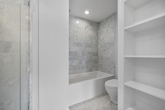 bathroom featuring recessed lighting, bathing tub / shower combination, and toilet