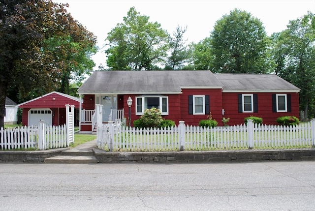5 Leedburg St, Chelmsford, MA 01863 - ranch-style home featuring a detached garage, a fenced front yard, and an outbuilding
