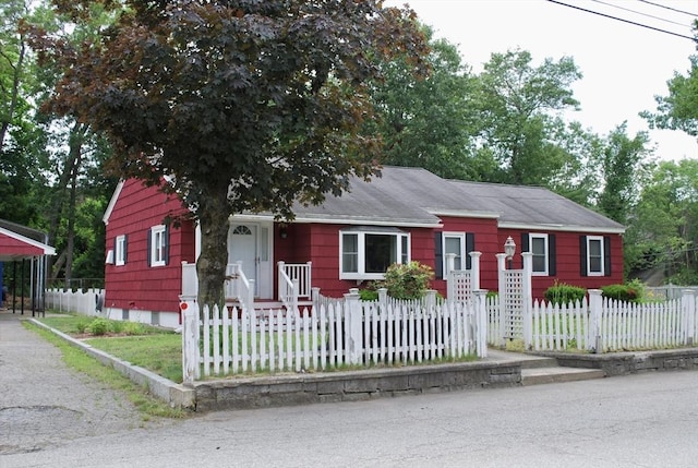 5 Leedburg St, Chelmsford, MA 01863 - bungalow-style house featuring a fenced front yard, a carport, and driveway