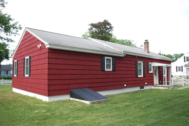 5 Leedburg St, Chelmsford, MA 01863 - rear view of house featuring a chimney