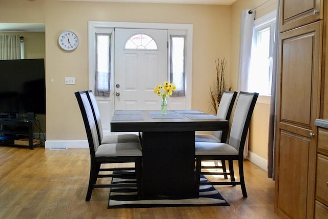 5 Leedburg St, Chelmsford, MA 01863 - dining area featuring light wood-style flooring and plenty of natural light