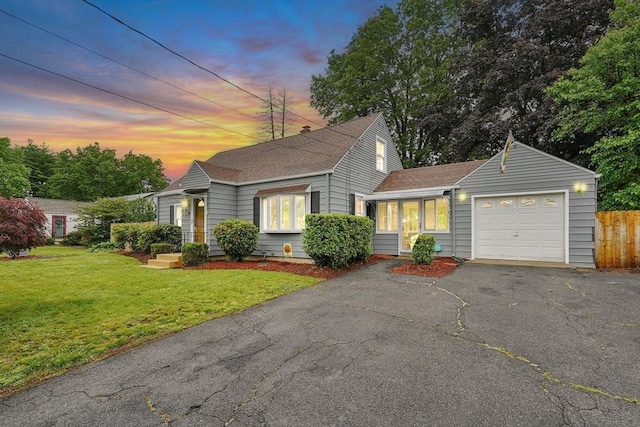 122 Brookside Cir, Springfield, MA 01129 - view of front of property with an attached garage, a shingled roof, and asphalt driveway