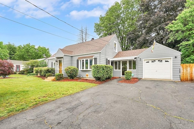 122 Brookside Cir, Springfield, MA 01129 - traditional-style house with a garage, driveway, and roof with shingles