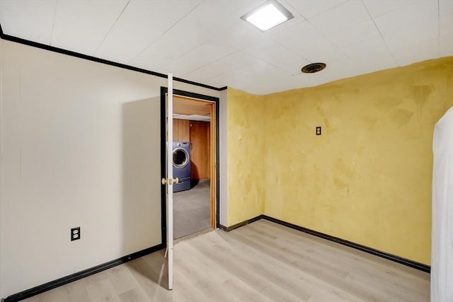 122 Brookside Cir, Springfield, MA 01129 - unfurnished room featuring washer / dryer and light wood-style flooring