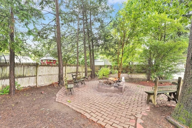 122 Brookside Cir, Springfield, MA 01129 - fenced backyard featuring a fire pit and a patio