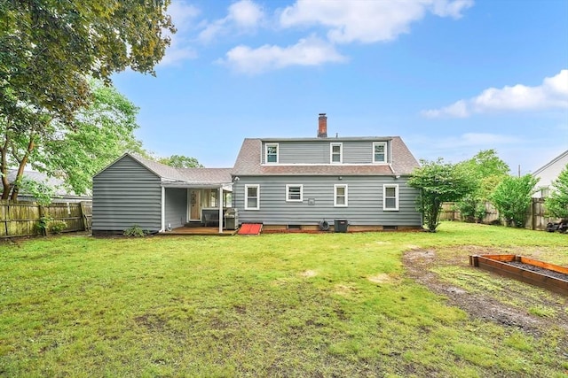 122 Brookside Cir, Springfield, MA 01129 - back of property featuring a fenced backyard, a chimney, a shingled roof, crawl space, and a wooden deck