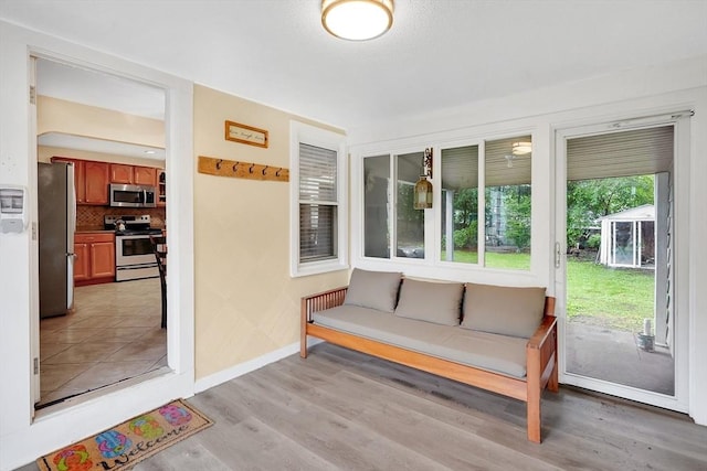 122 Brookside Cir, Springfield, MA 01129 - sunroom with baseboards and wood finished floors