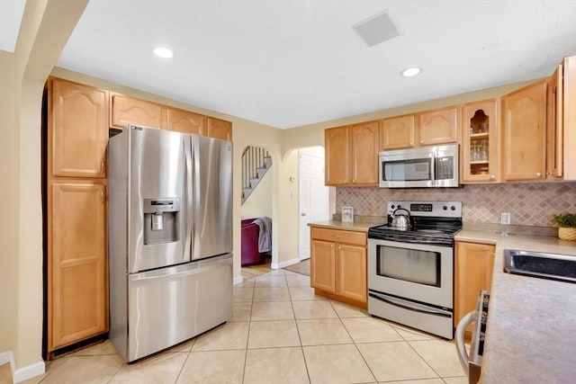 122 Brookside Cir, Springfield, MA 01129 - kitchen with appliances with stainless steel finishes, light brown cabinets, light countertops, backsplash, and recessed lighting