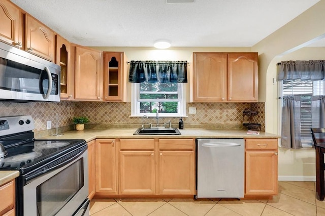 122 Brookside Cir, Springfield, MA 01129 - kitchen featuring stainless steel appliances, light countertops, and decorative backsplash
