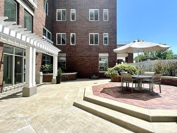 view of patio with fence, a pergola, and outdoor dining space