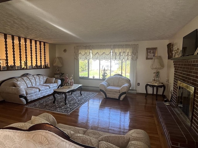 living room with a textured ceiling and wood finished floors