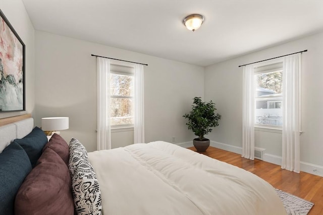 bedroom with wood-type flooring