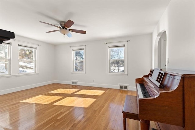 misc room with ceiling fan and light hardwood / wood-style flooring