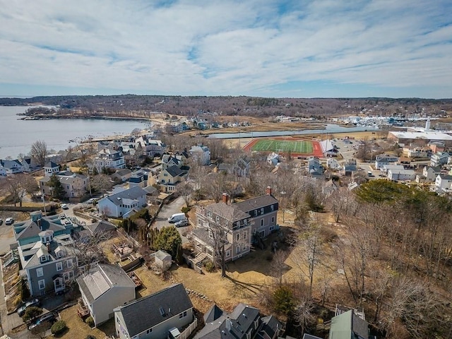 drone / aerial view featuring a water view and a residential view