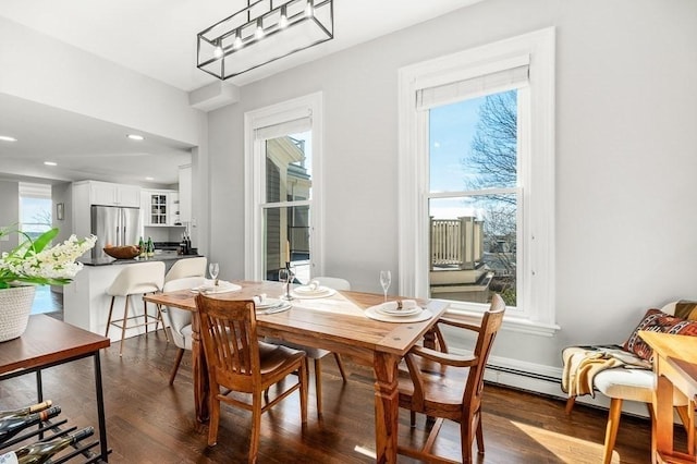 dining space with recessed lighting and dark wood-style flooring