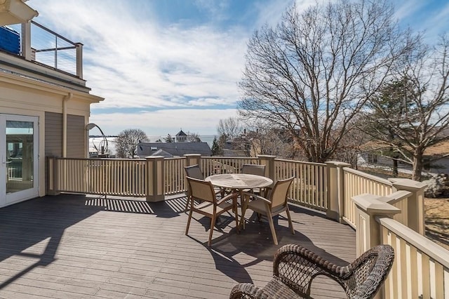 wooden deck featuring outdoor dining space