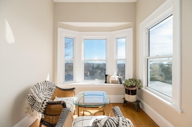 sitting room featuring wood finished floors and baseboards