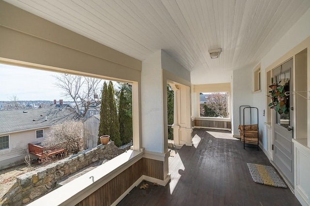 sunroom / solarium with a wealth of natural light and wooden ceiling