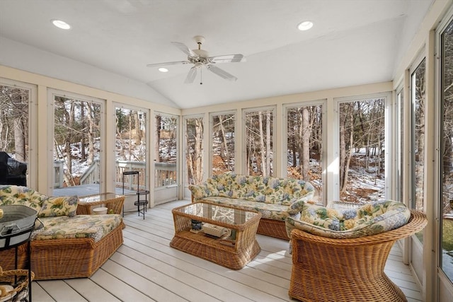 sunroom with a ceiling fan and lofted ceiling