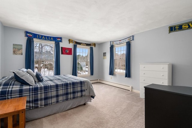 carpeted bedroom with multiple windows, baseboards, and a baseboard radiator