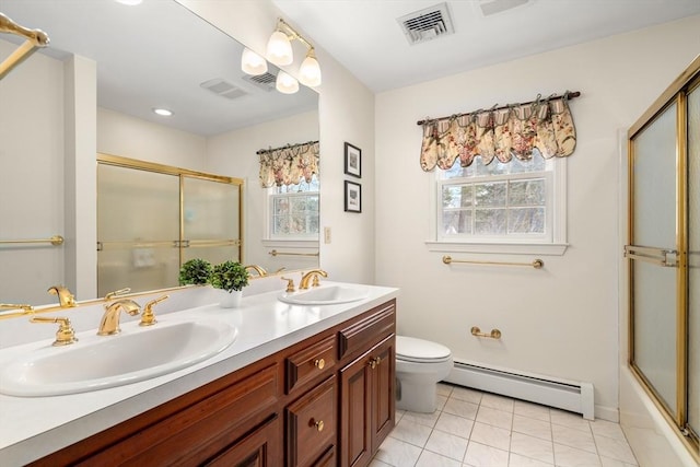 full bathroom featuring a wealth of natural light, a sink, visible vents, and a baseboard radiator