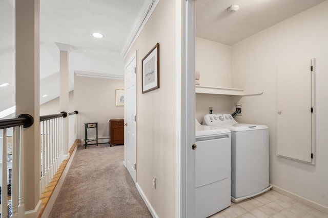 laundry room with a baseboard heating unit, baseboards, and independent washer and dryer