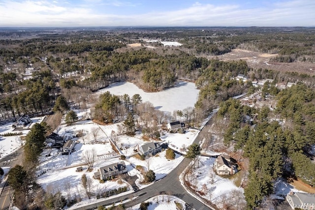 snowy aerial view with a forest view