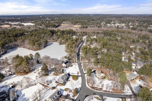 birds eye view of property featuring a wooded view