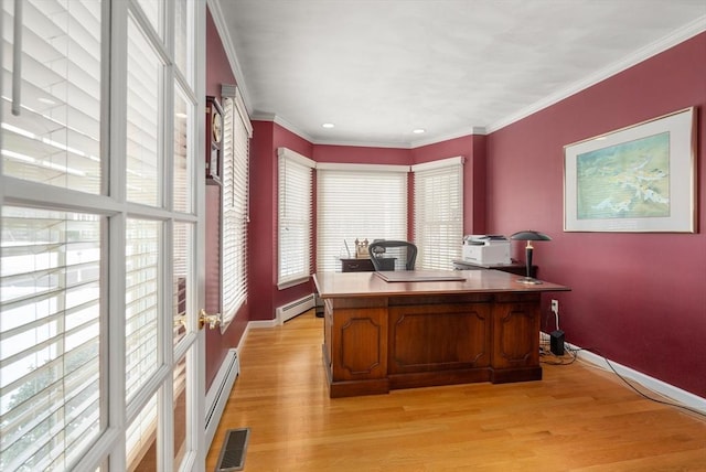 home office with baseboards, visible vents, ornamental molding, a baseboard heating unit, and light wood-type flooring