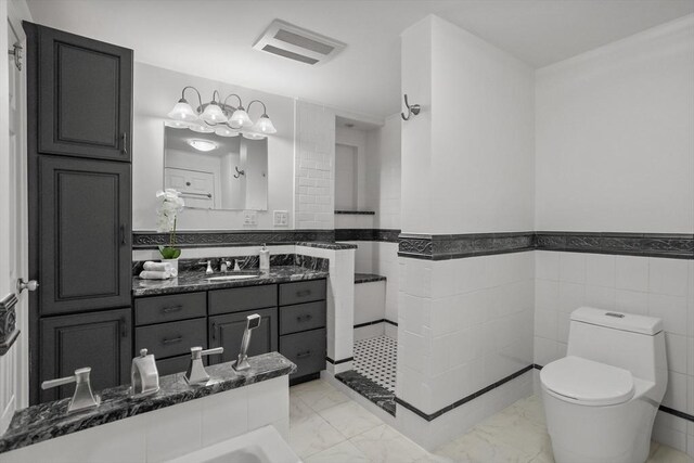 full bathroom featuring walk in shower, vanity, toilet, marble finish floor, and visible vents