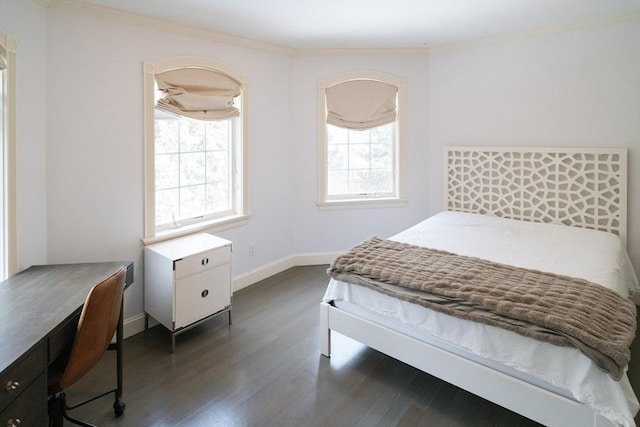 bedroom with dark wood-style floors, multiple windows, crown molding, and baseboards