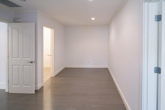 spare room featuring baseboards, dark wood-style flooring, crown molding, and recessed lighting