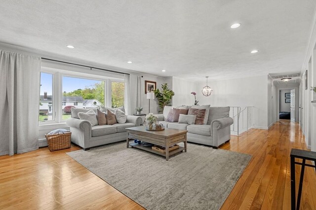 9 Indian Rock Dr, Saugus, MA 01906 - living room featuring light wood-style floors, recessed lighting, baseboards, and a chandelier