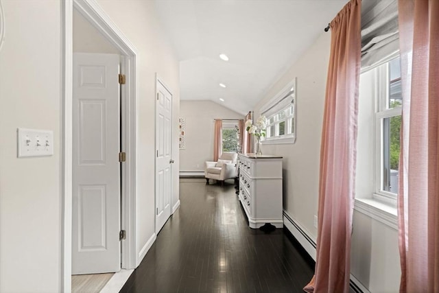 9 Indian Rock Dr, Saugus, MA 01906 - hall with vaulted ceiling, dark wood finished floors, baseboard heating, baseboards, and a baseboard heating unit