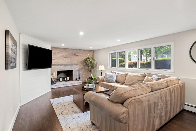 9 Indian Rock Dr, Saugus, MA 01906 - living room featuring baseboards, dark wood-type flooring, recessed lighting, a fireplace, and a baseboard heating unit