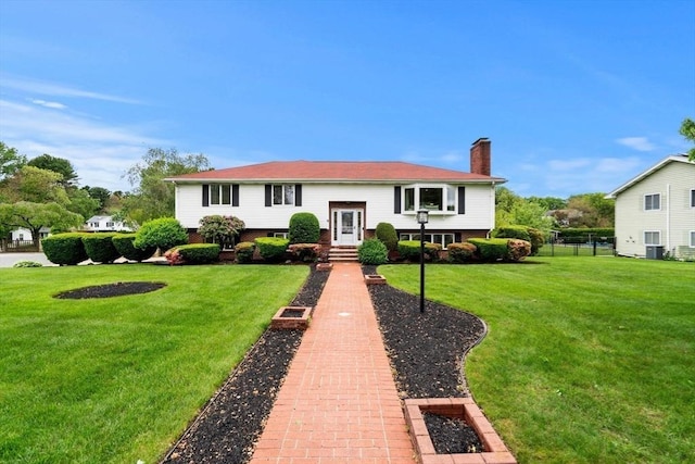 9 Indian Rock Dr, Saugus, MA 01906 - bi-level home with a chimney