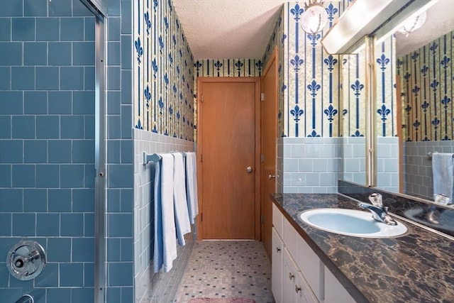 24 Charles Dr, Canton, MA 02021 - full bath featuring tile walls, wallpapered walls, an enclosed shower, a textured ceiling, and vanity