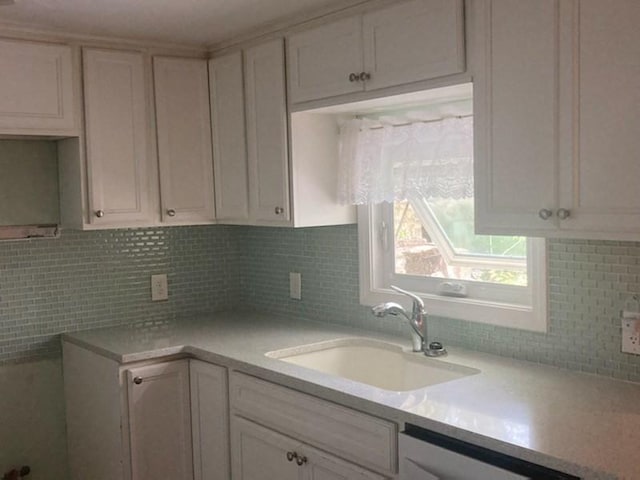 44 Tallawanda Rd, Swansea, MA 02777 - kitchen featuring a sink, backsplash, dishwasher, and light countertops