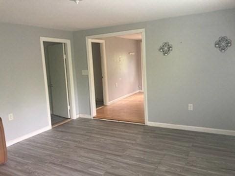 44 Tallawanda Rd, Swansea, MA 02777 - spare room with wood finished floors and baseboards