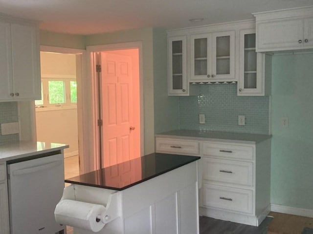 44 Tallawanda Rd, Swansea, MA 02777 - kitchen featuring white dishwasher, tasteful backsplash, white cabinets, baseboards, and glass insert cabinets