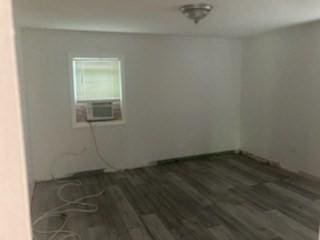 44 Tallawanda Rd, Swansea, MA 02777 - empty room with wood finished floors and cooling unit