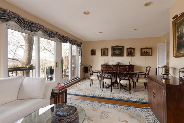 dining room with recessed lighting and wood finished floors