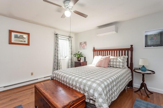 bedroom featuring hardwood / wood-style floors, baseboard heating, a ceiling fan, a wall mounted air conditioner, and baseboards